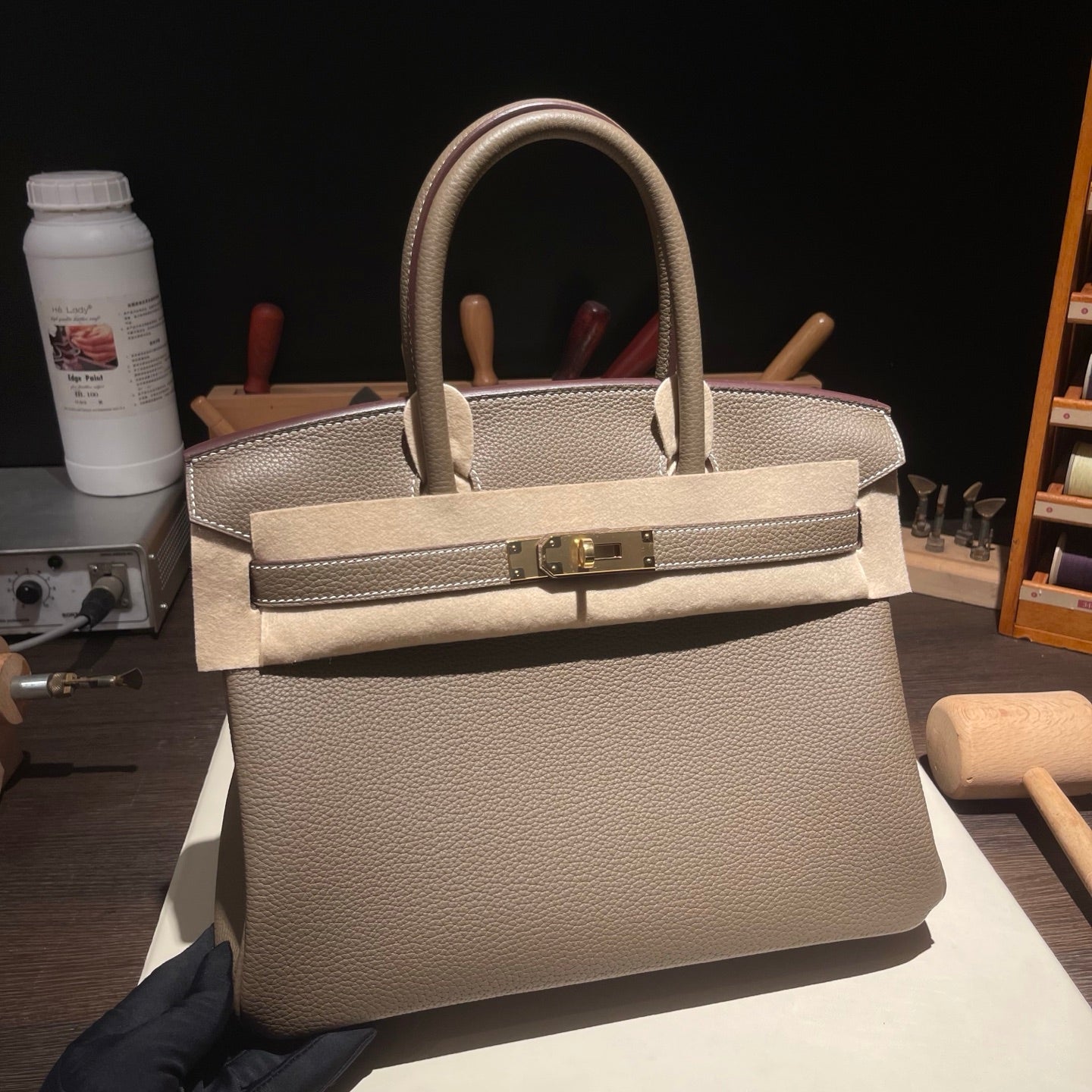 Handmade etoupe Togo leather top handle bag 30cm detail view 1