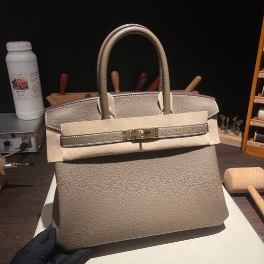Handmade etoupe Togo leather top handle bag 30cm detail view 1