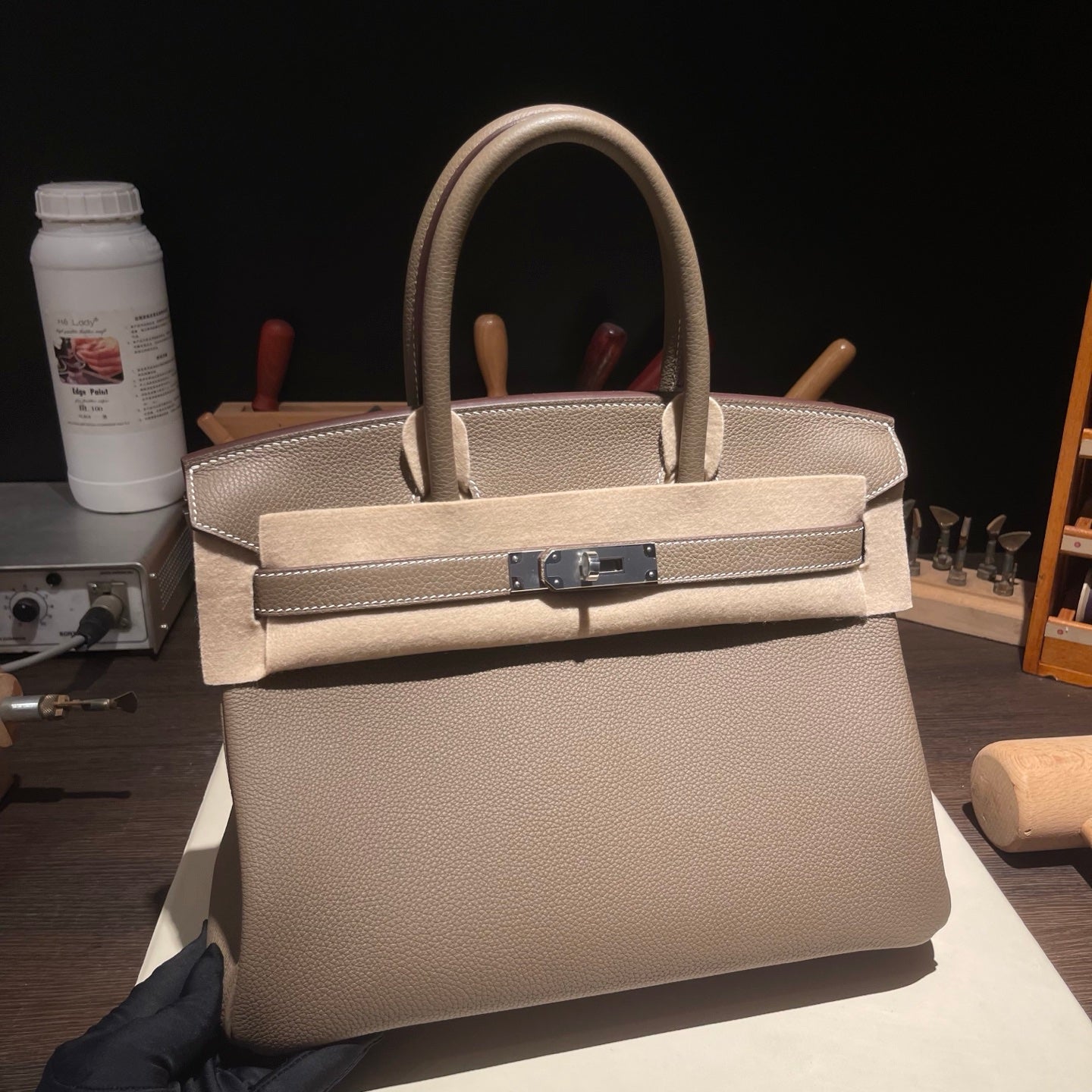 Handmade Etoupe Togo leather top handle bag with silver hardware 30cm detail view 1