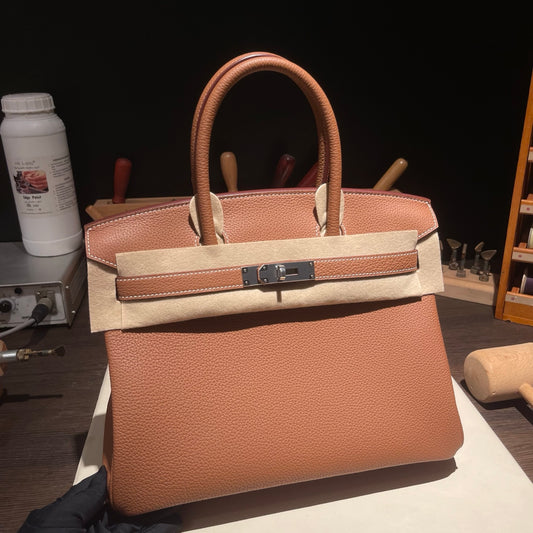 Handmade Gold Brown Togo leather top handle bag with silver hardware 30cm detail view 1