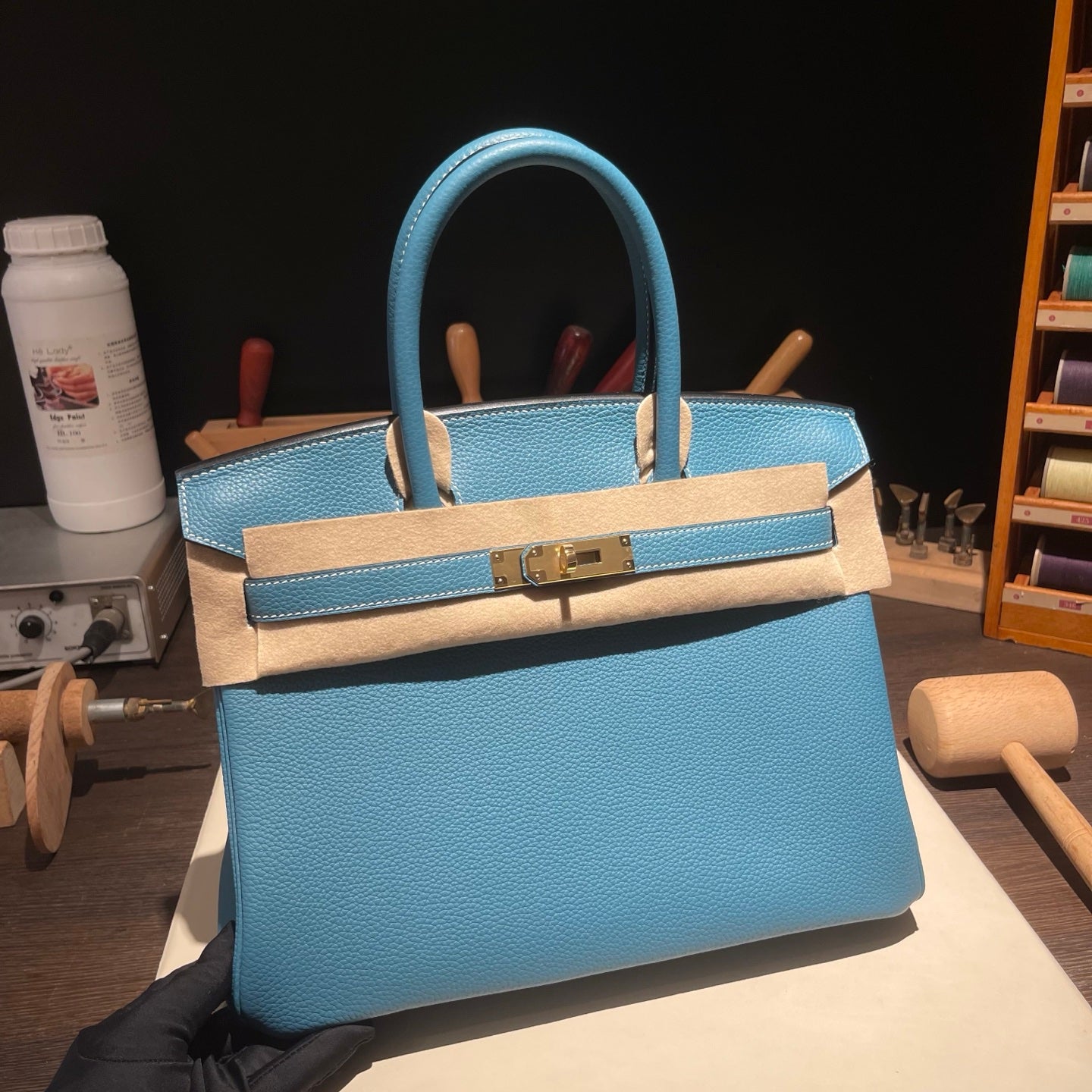 Handmade Denim Blue Togo leather top handle bag with gold hardware 30cm detail view 1