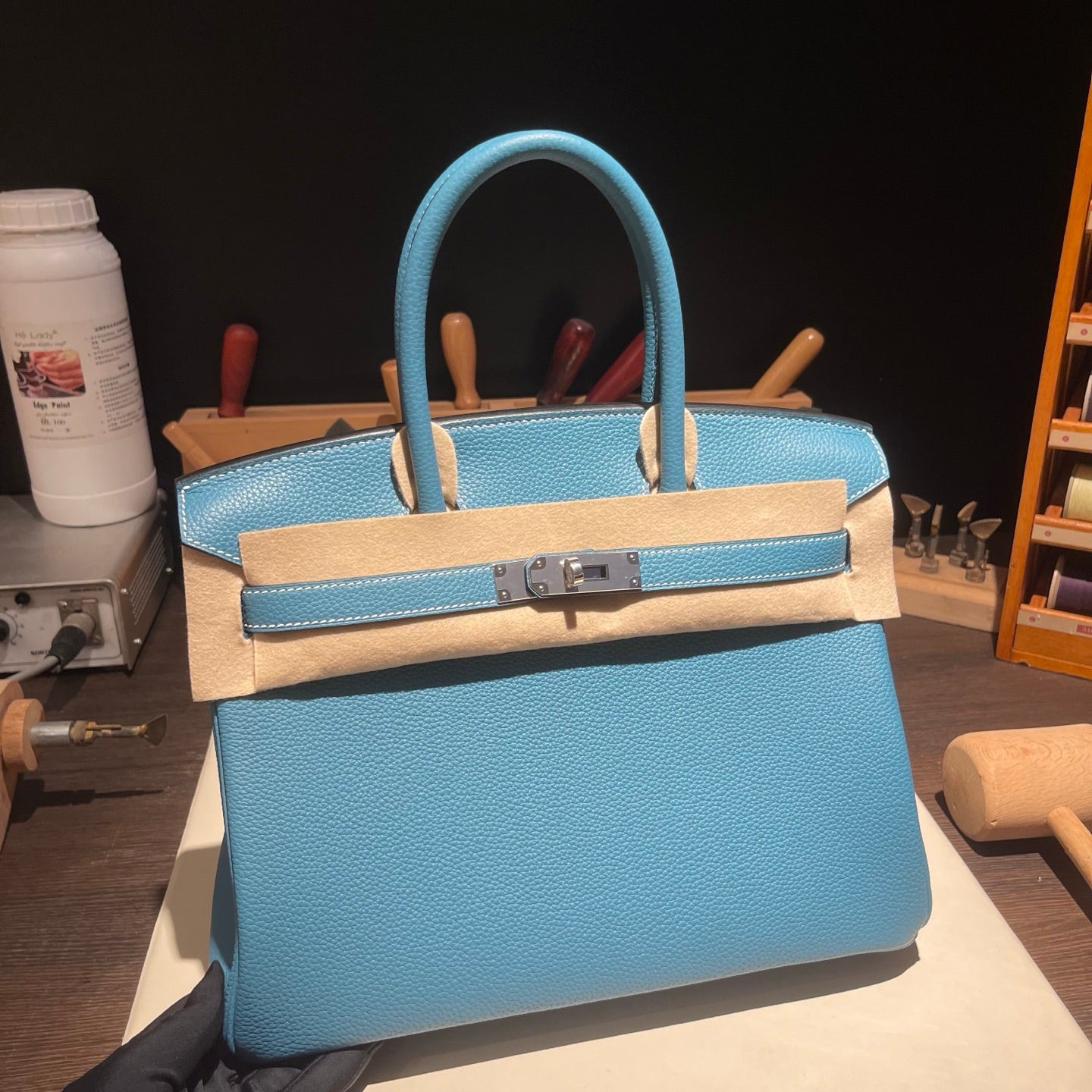 Handmade Denim Blue Togo leather top handle bag with silver hardware 30cm detail view 1