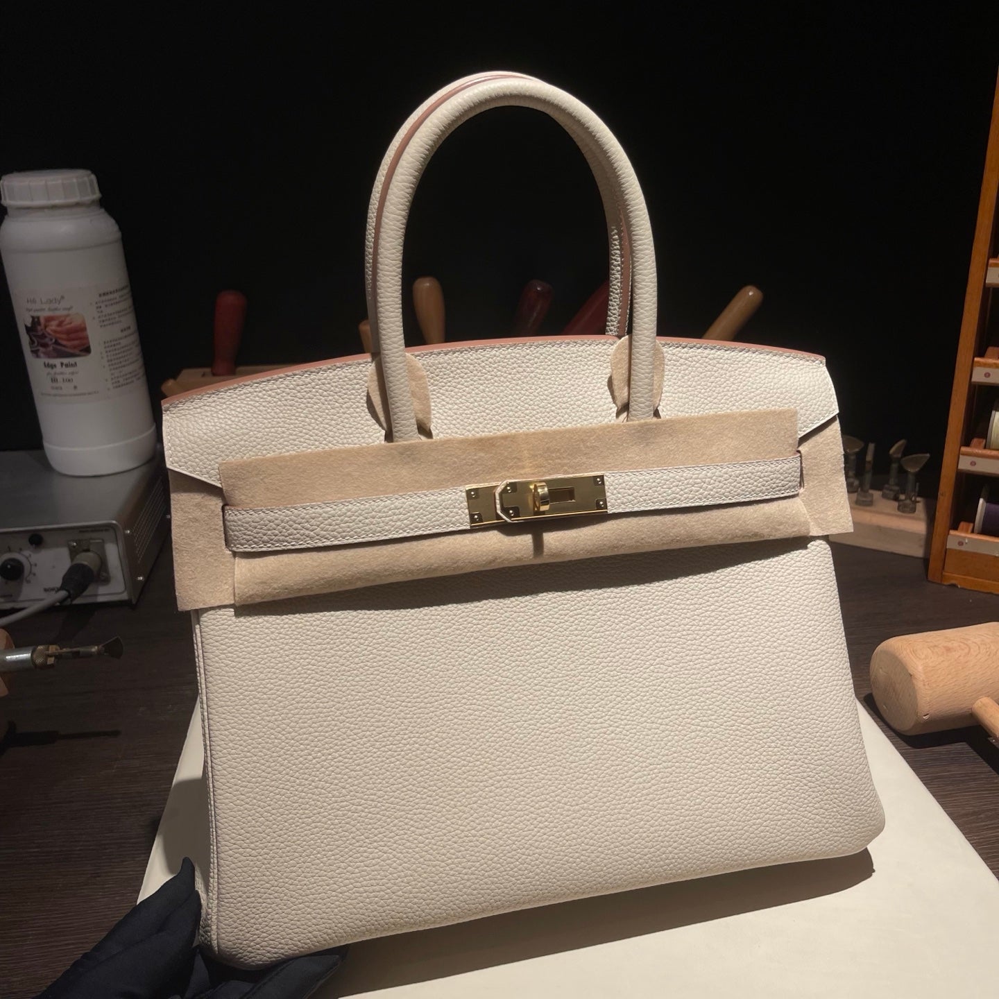 Handmade Milkshake White Togo leather top handle bag with gold hardware 30cm detail view 1
