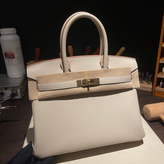 Handmade Milkshake White Togo leather top handle bag with gold hardware 30cm detail view 1