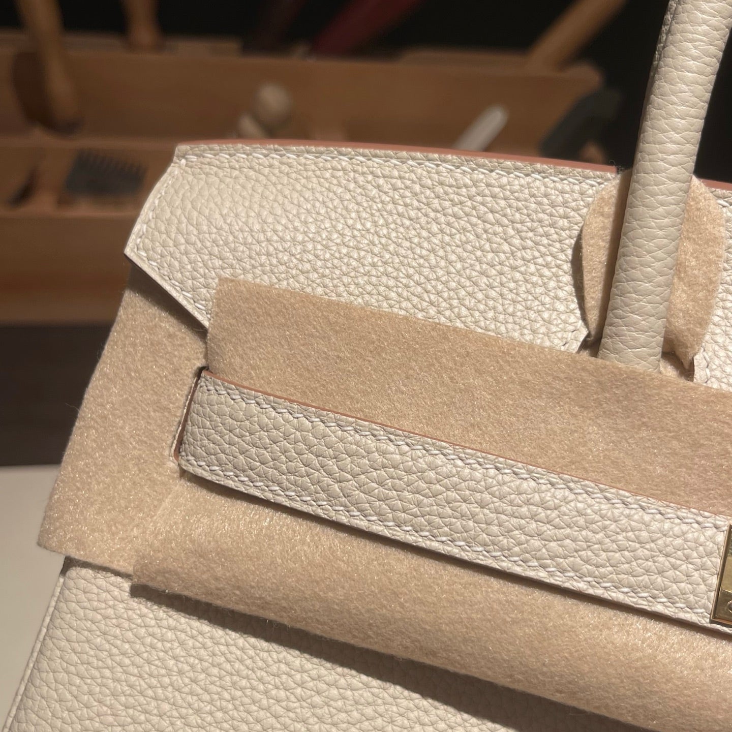 Handmade Milkshake White Togo leather top handle bag with gold hardware 30cm detail view 3