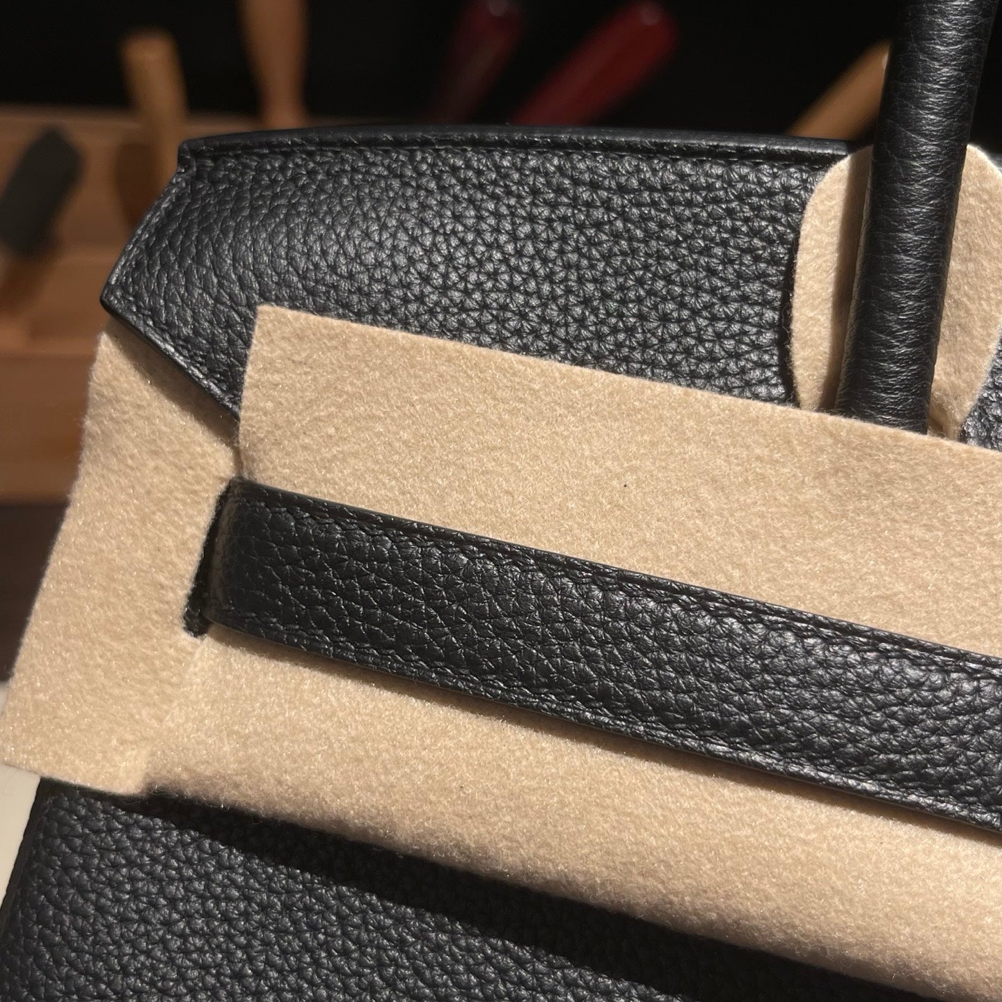 Handmade black top handle bag silver hardware close-up