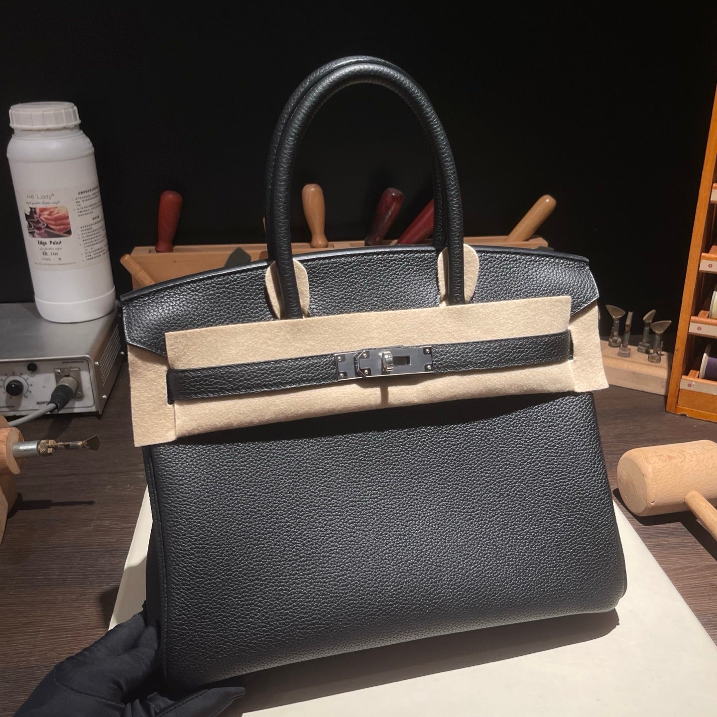 Handmade black Togo leather top handle bag 30cm front view