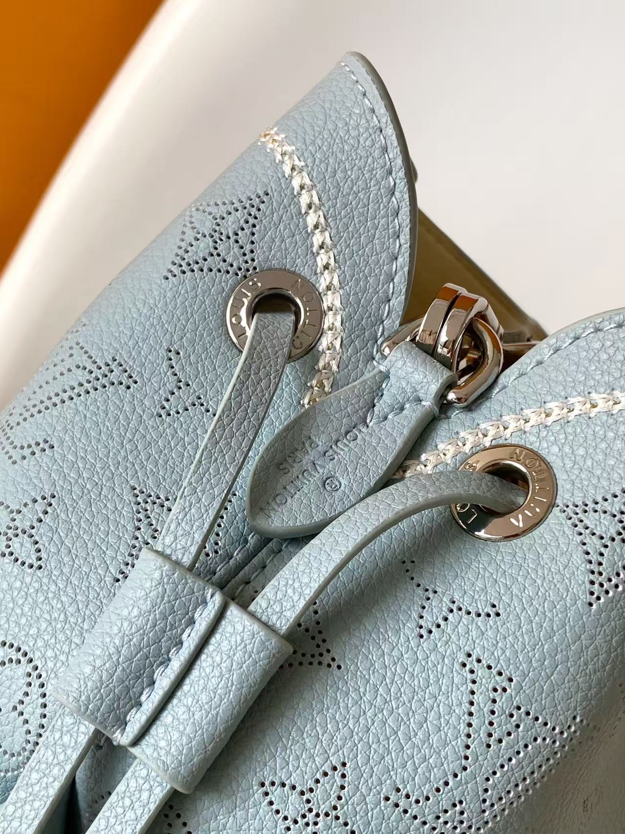 Perforated Leather Bucket Bag M28885